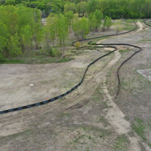 Silt fence to prevent erosion along trail